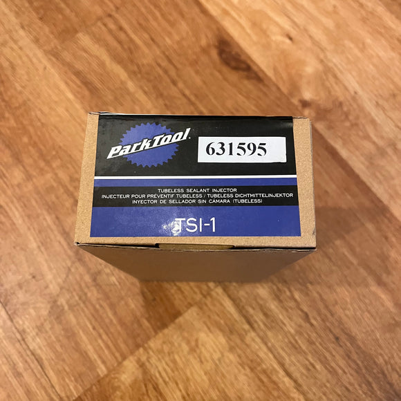 Photo showing the TSI-1 Tubeless sealant injector.  The photo shows the slight damage of the packaging.