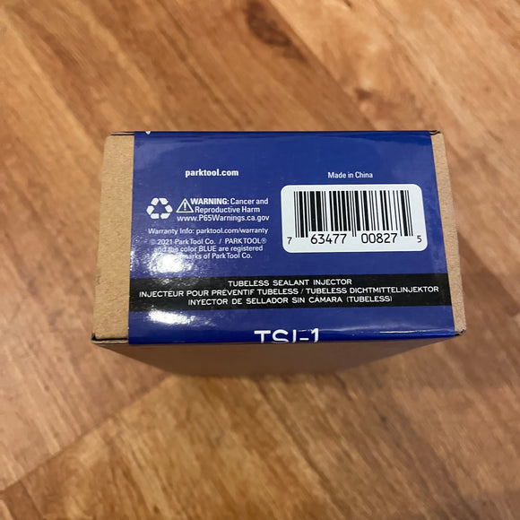 Photo showing the TSI-1 Tubeless sealant injector.  The photo shows the slight damage of the packaging.