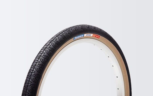 Side view of two Panaracer 20"x1.75 HP406 skinwall black tire.