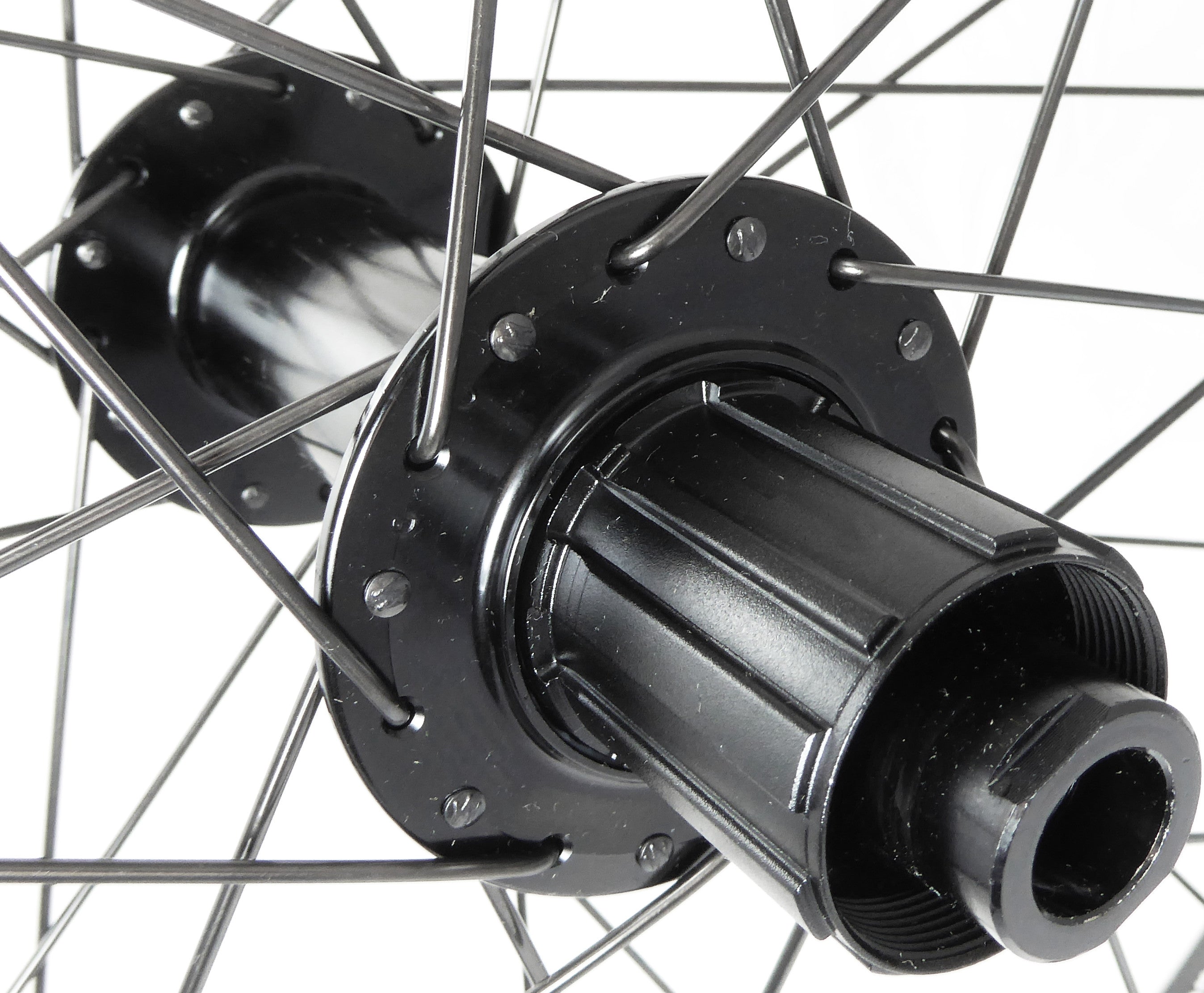 A closeup of the rear hub with a cassette type freehub body.